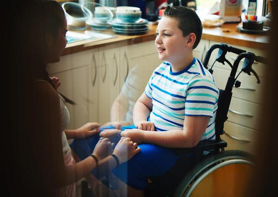 A boy in a wheelchair